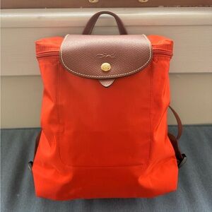 Longchamp Le Pliage style backpack orange